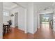 Bright hallway showcasing beautiful hardwood floors and elegant trim work at 713 Apalachia Lake Dr, Fuquay Varina, NC 27526