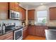Kitchen with stainless appliances, granite countertops, and ample cabinet space at 713 Apalachia Lake Dr, Fuquay Varina, NC 27526