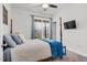 Well-lit bedroom with a plush carpet, a four-poster bed and large windows at 74 Hidden Grove Ct, Garner, NC 27529