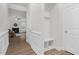 Mud room with built in hall tree and white wainscoting at 74 Hidden Grove Ct, Garner, NC 27529