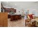 Open kitchen boasts wood cabinets, granite countertops and a center island with bar stool seating at 74 Hidden Grove Ct, Garner, NC 27529