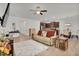 Open concept with living room, kitchen, and dining space featuring wood floors and neutral colors at 74 Hidden Grove Ct, Garner, NC 27529