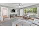 Bright living room with hardwood floors, a gray sofa, and a large window at 774 Salem Church Rd, Sanford, NC 27330