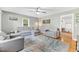 Cozy living room featuring hardwood floors and comfortable gray seating arrangement at 774 Salem Church Rd, Sanford, NC 27330