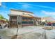 Large concrete backyard with a screened in porch and various vehicles at 1022 Early Rise St St, Raleigh, NC 27610