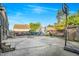Large concrete backyard with a basketball hoop, shed, and off-road vehicles at 1022 Early Rise St St, Raleigh, NC 27610