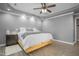 Spacious bedroom with a king-size bed, modern decor, and hardwood floors at 1022 Early Rise St St, Raleigh, NC 27610