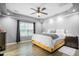 Comfortable bedroom with a ceiling fan, a neutral color palette and wood floors at 1022 Early Rise St St, Raleigh, NC 27610