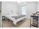 Bright bedroom features hardwood floors, a ceiling fan, and a window for ample natural light at 1022 Early Rise St St, Raleigh, NC 27610
