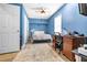 Blue bedroom with carpet and a desk area at 1022 Early Rise St St, Raleigh, NC 27610