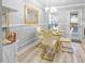 Chic dining room with a glass table, gold accents, and modern decor at 1022 Early Rise St St, Raleigh, NC 27610