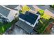 Aerial view of a home with solar panels and a large backyard at 1022 Early Rise St St, Raleigh, NC 27610