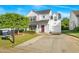 Attractive two-story home with an attached garage, manicured lawn, and 'For Sale' sign at 1022 Early Rise St St, Raleigh, NC 27610