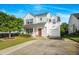 Charming two-story home with a well-manicured lawn, attached garage, and red front door at 1022 Early Rise St St, Raleigh, NC 27610