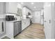 Clean kitchen featuring white cabinets, stainless steel appliances, and a modern design at 1022 Early Rise St St, Raleigh, NC 27610
