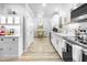 Bright kitchen featuring white cabinets, stainless steel appliances, and an open concept design at 1022 Early Rise St St, Raleigh, NC 27610