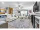 Spacious living room featuring modern decor, hardwood floors, plush couches, and comfortable seating at 1022 Early Rise St St, Raleigh, NC 27610