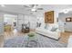 Open-concept living room featuring modern decor, hardwood floors, and a comfortable seating area at 1022 Early Rise St St, Raleigh, NC 27610