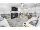 Cozy living room with a fireplace, built-in shelving, a ceiling fan, and comfortable seating at 1022 Early Rise St St, Raleigh, NC 27610