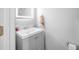 Neat powder room featuring gray vanity with storage and illuminated mirror at 1022 Early Rise St St, Raleigh, NC 27610
