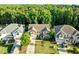 An aerial view of this two-story house in a wooded neighborhood at 109 Highland Mist Cir, Apex, NC 27539