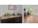 Chic bar area with granite countertops and dark cabinetry, seamlessly connected to the kitchen and dining area at 109 Highland Mist Cir, Apex, NC 27539