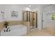 Bright bathroom with stylish tub and walk-in shower at 109 Highland Mist Cir, Apex, NC 27539