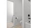 Contemporary bathroom featuring a toilet, tiled flooring, and shower with black fixtures at 109 Highland Mist Cir, Apex, NC 27539