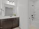 Bathroom with vanity and granite counters, white walls and access to a tub and shower at 109 Highland Mist Cir, Apex, NC 27539