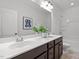 Bathroom featuring a large vanity, plant decor, and an adjacent shower and toilet at 109 Highland Mist Cir, Apex, NC 27539