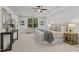 This primary bedroom features a trey ceiling and a window with views of the wooded backyard at 109 Highland Mist Cir, Apex, NC 27539