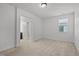 Bright bedroom featuring neutral tones and a view into an attached bathroom at 109 Highland Mist Cir, Apex, NC 27539