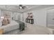 Spacious primary bedroom featuring a trey ceiling, a ceiling fan, and modern decor at 109 Highland Mist Cir, Apex, NC 27539