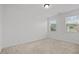 Bedroom with neutral carpet, two windows bringing in natural light, and white walls at 109 Highland Mist Cir, Apex, NC 27539
