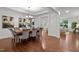 Elegant dining room showcasing hardwood floors, a chandelier, and a spacious layout perfect for entertaining guests at 109 Highland Mist Cir, Apex, NC 27539
