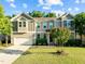Charming two-story home featuring a well-manicured lawn, attached two-car garage, and traditional architectural details at 109 Highland Mist Cir, Apex, NC 27539