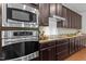 This kitchen features stainless steel appliances and granite countertops at 109 Highland Mist Cir, Apex, NC 27539