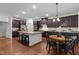 Well-designed kitchen with stainless steel appliances, granite counters, and adjacent dining area, perfect for everyday living at 109 Highland Mist Cir, Apex, NC 27539