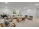 Spacious living area featuring comfortable seating, a dining area, and plenty of natural light at 109 Highland Mist Cir, Apex, NC 27539