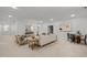 Bright living room with neutral tones featuring seating and dining areas, perfect for entertaining guests at 109 Highland Mist Cir, Apex, NC 27539