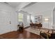 Bright office space featuring hardwood floors, a large window, and stylish furniture; ideal for remote work at 109 Highland Mist Cir, Apex, NC 27539