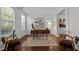Bright office space featuring hardwood floors, a large window, and stylish furniture; ideal for remote work at 109 Highland Mist Cir, Apex, NC 27539