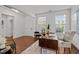 Bright office space featuring hardwood floors, a large window, and stylish furniture; ideal for remote work at 109 Highland Mist Cir, Apex, NC 27539