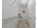 This walk-in closet has metal shelving and bars for optimal storage at 109 Highland Mist Cir, Apex, NC 27539