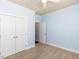 Neutral bedroom with carpet, white doors and trim, light blue walls, and ceiling fan at 112 Victorian Oaks Dr, Durham, NC 27713