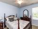Comfortable bedroom featuring a ceiling fan, wooden furniture, and soft natural light at 112 Victorian Oaks Dr, Durham, NC 27713