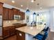 Gourmet kitchen featuring granite countertops, stainless steel appliances, and a stylish island at 112 Victorian Oaks Dr, Durham, NC 27713