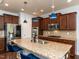 Well-equipped kitchen with granite countertops, pendant lighting, and modern stainless steel appliances at 112 Victorian Oaks Dr, Durham, NC 27713