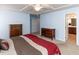 Spacious main bedroom features carpet, neutral walls, white trim, and views into the bathroom at 112 Victorian Oaks Dr, Durham, NC 27713