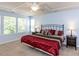 Comfortable main bedroom showcasing a coffered ceiling, large windows, and contemporary furniture at 112 Victorian Oaks Dr, Durham, NC 27713